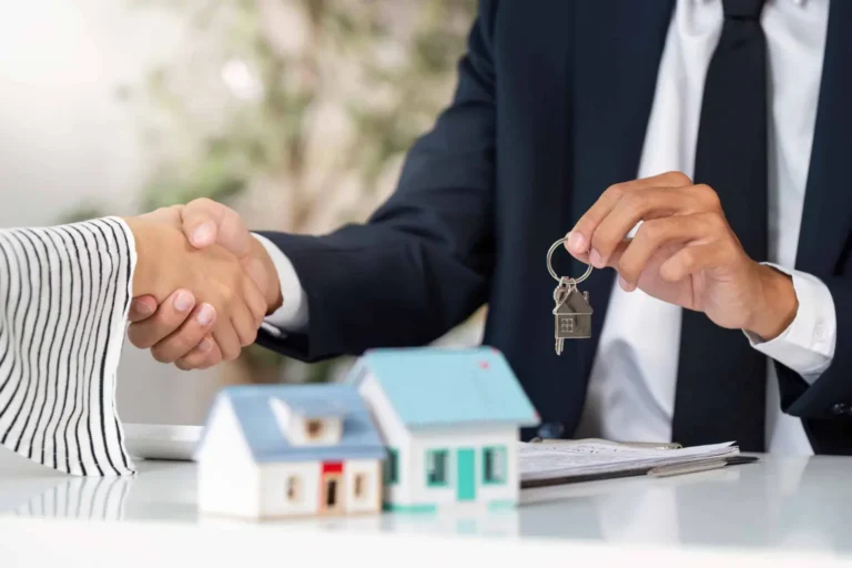 Buyer and seller reviewing a Nevada property transaction in an HOA community